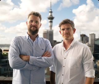 Jamie Jermain and Jovan Pavlicevic with the Sky Tower behind